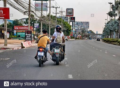 broken-down-motorcycle-getting-a-push-along-from-another-biker-to-the-nearest-repair-shop-thailand-southeast-asia-2B7KF9D